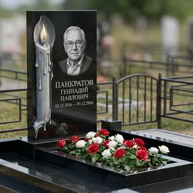 Памятник с горящей свечой из габбро-диабаза с портретом
